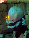 Eine Zwergenfigur mit Bergbauarbeiterhelm, mit Kerze vorne auf dem Helm