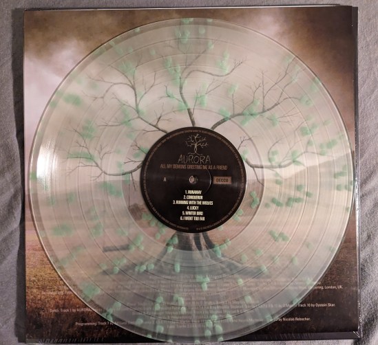 Vinyl-Platte von AURORA ALL MY DEMONS GREETING ME AS A FRIEND in weißem Transparent mit grünen Farbspritzern
